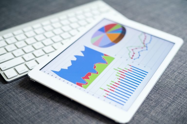 Business charts and diagrams on digital tablet